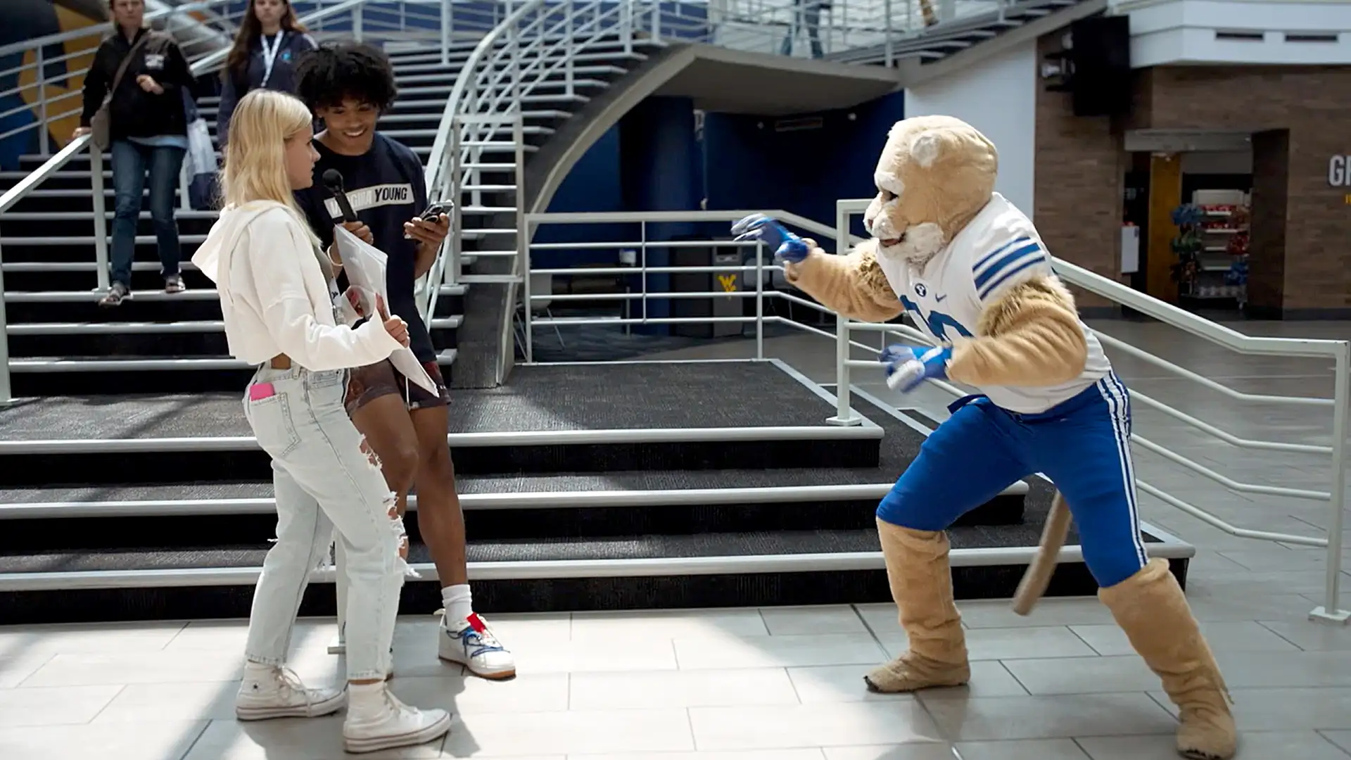 Trey Stewart and Cosmo plays charades with WVU students