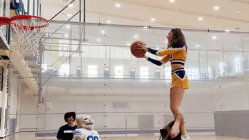 Cosmo, Trey Stewart, WVU Cheerleaders, and WVU Mascot plays basketball
