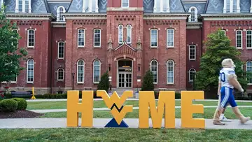 Cosmo and Trey Stewart walk around WVU Campus