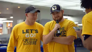 Trey Stewart plays a music guessing game with the Tabernacle Choir and John Denver